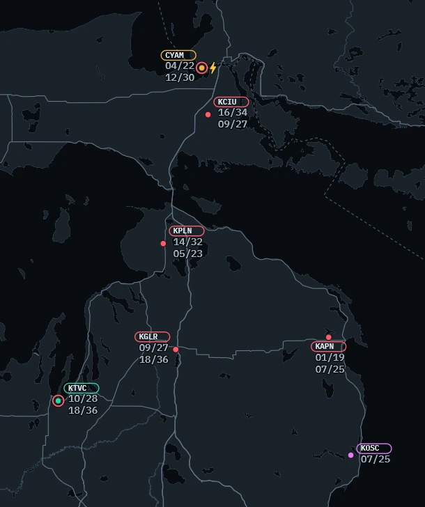 Conditions layer of the app over northern Michigan: CYAM amber with a red ring and a CB bolt, KCIU, KPLN, KGLR and KAPN red, KTVC green with a red ring, KOSC purple, each with its runways