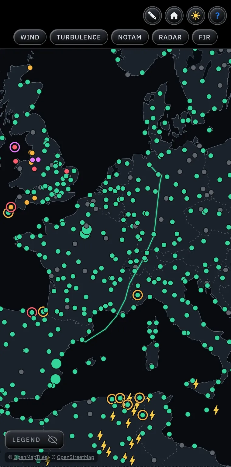 Map of Europe: aerodromes as green, amber, red or purple dots by visibility and ceiling, rings where the TAF forecasts worse, lightning bolts for CB, and the green route line from Barcelona to Hannover